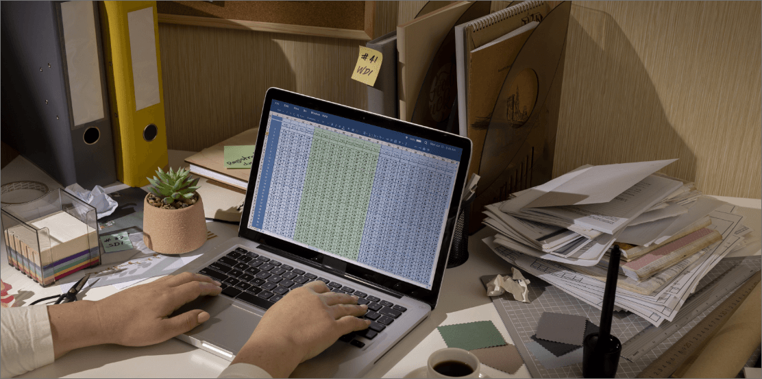 Person working on laptop with automated records