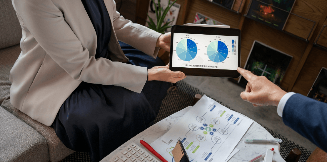 Employees analyzing charts to make informed finance decisions